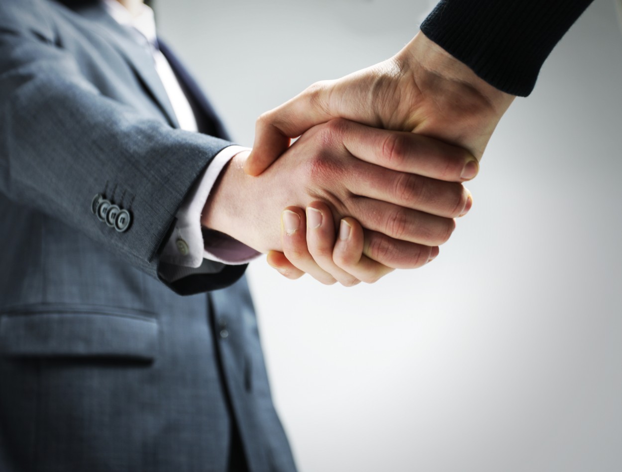 two-businessmen-shaking-hands-photo-F